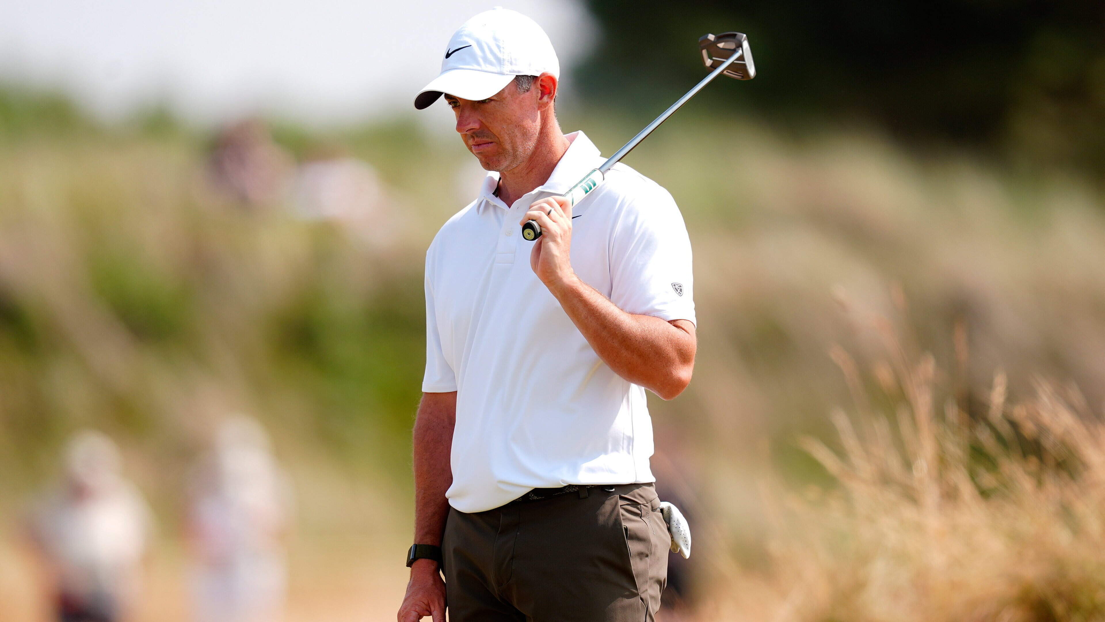 The Open, Day Three: Rory McIlroy sinks a long putt on the last hole as Tommy Fleetwood moves into contention