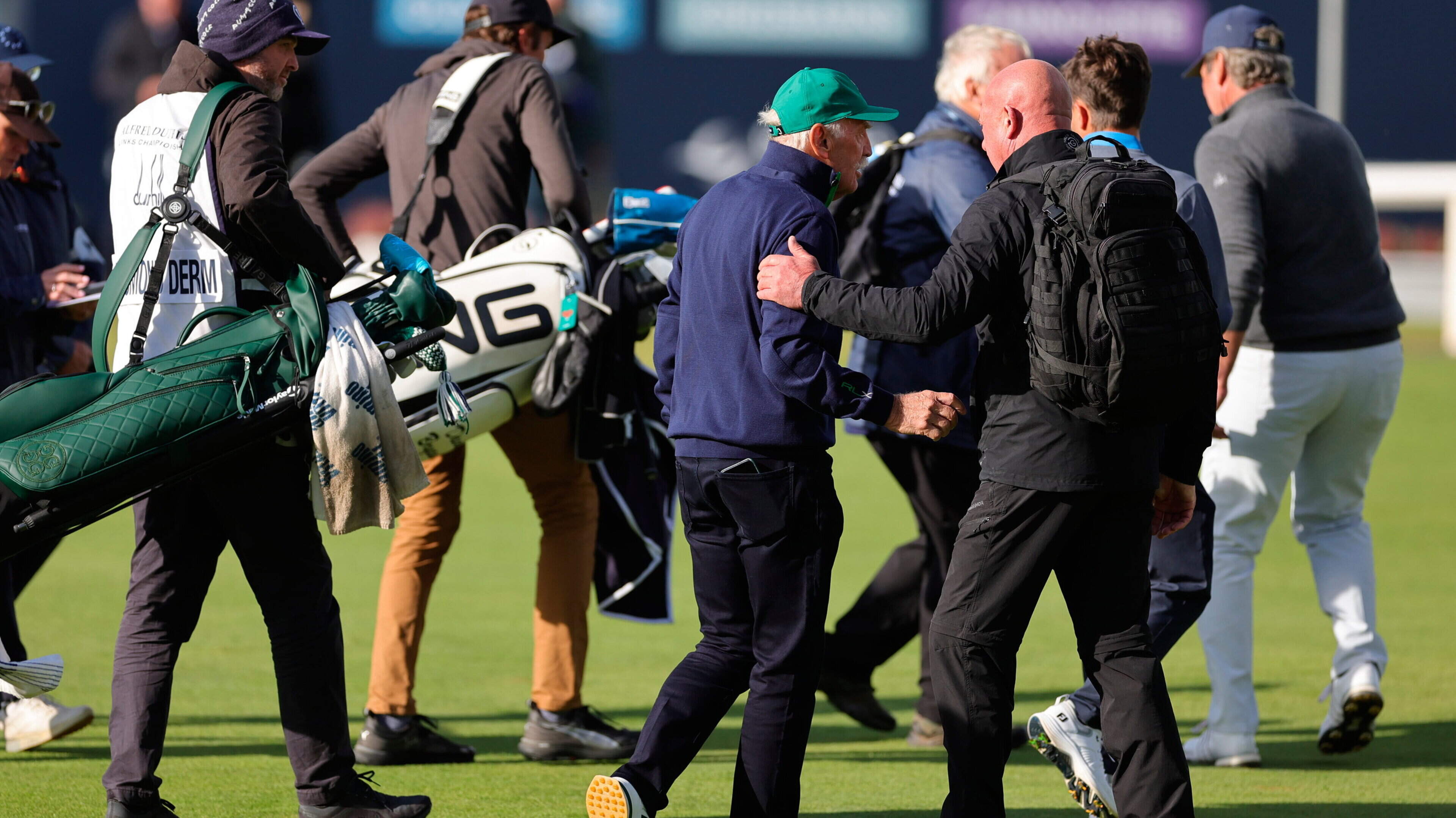 Celtic chief Dermot Desmond targeted by protest and leaves 18th green at St Andrews with a security guard