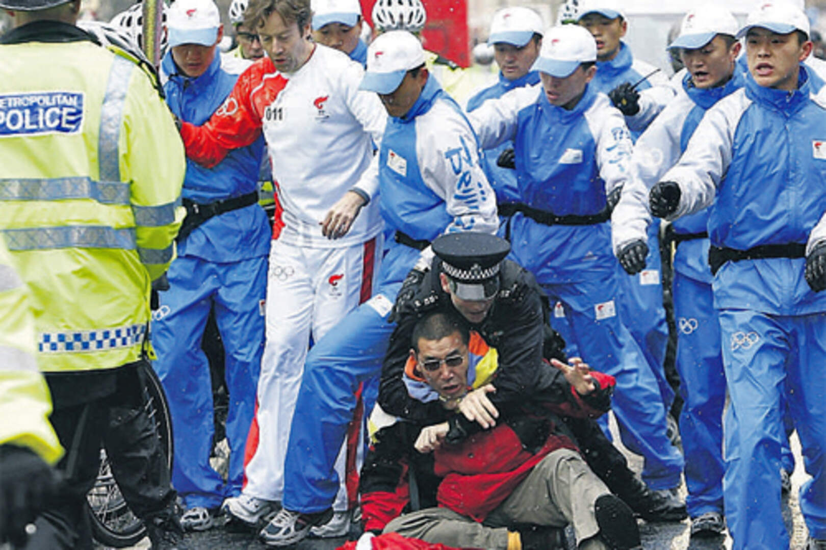 Chaotic scenes of police scuffling with anti-China campaigners as the Olympic torch made
its way through London