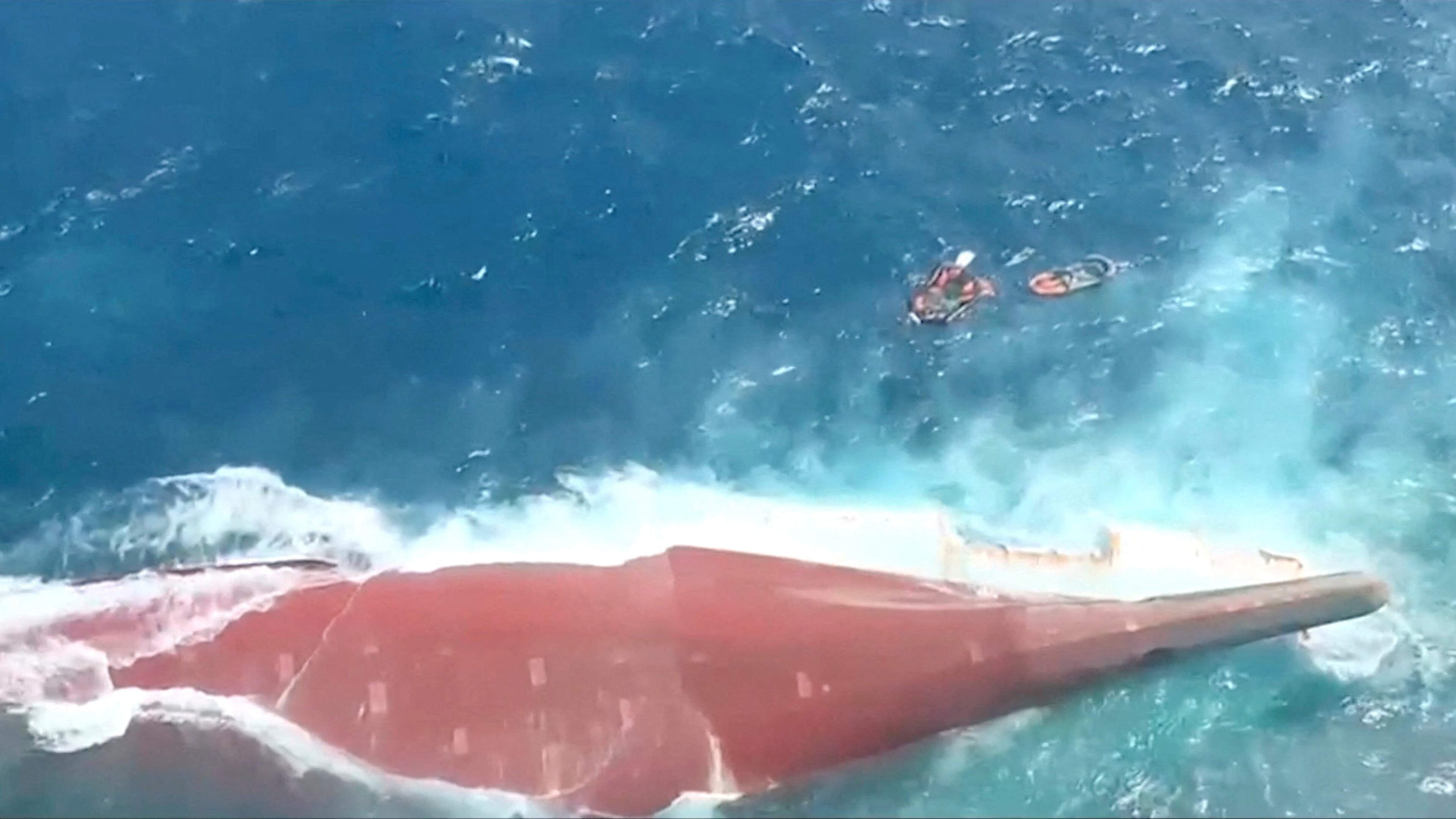 Over 100 people still missing as Indonesian rescuers battle choppy waters to board capsized passenger ship