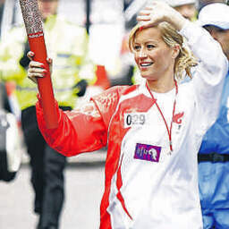 Denise Van Outen during her leg of the parade,
approaching Piccadilly Circus