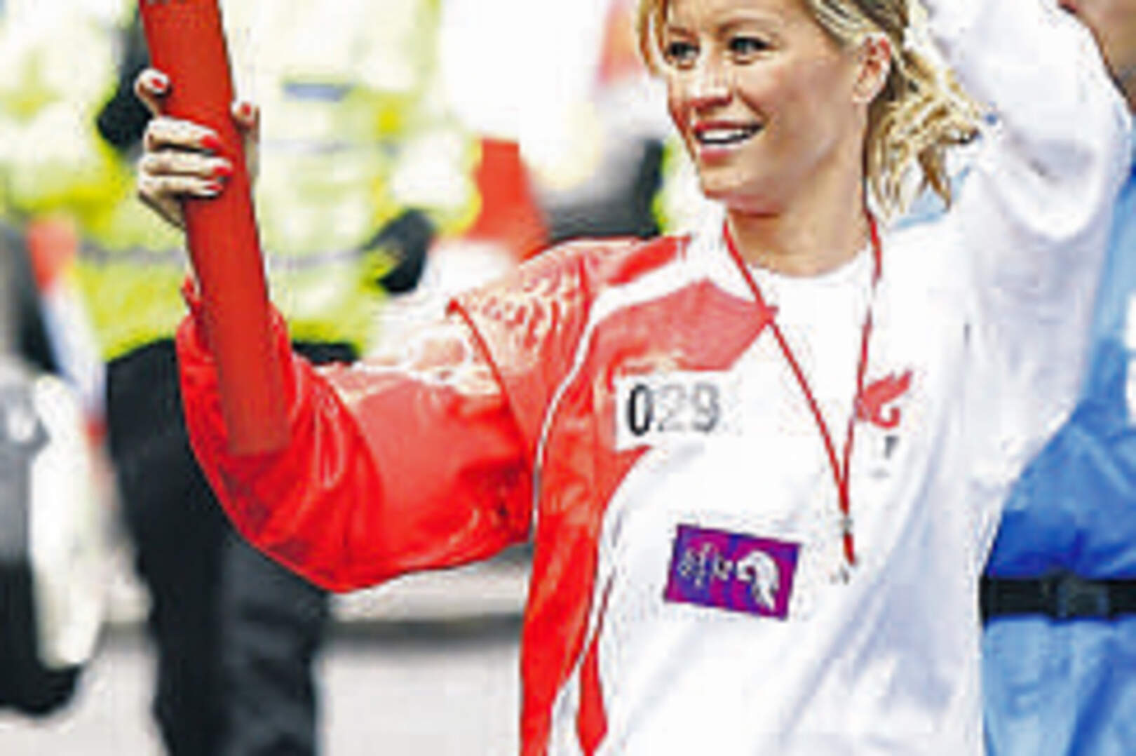 Denise Van Outen during her leg of the parade,
approaching Piccadilly Circus