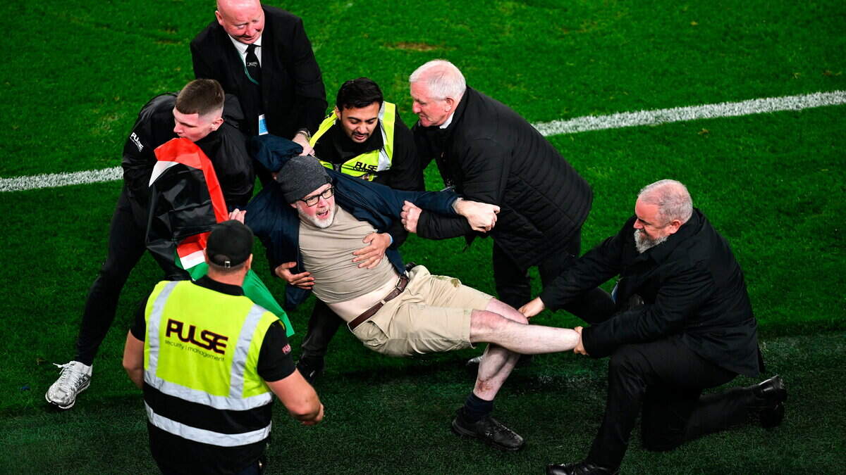 Ireland's clash with Austria interrupted by limited Palestine protests — tennis balls thrown and a pitch invader