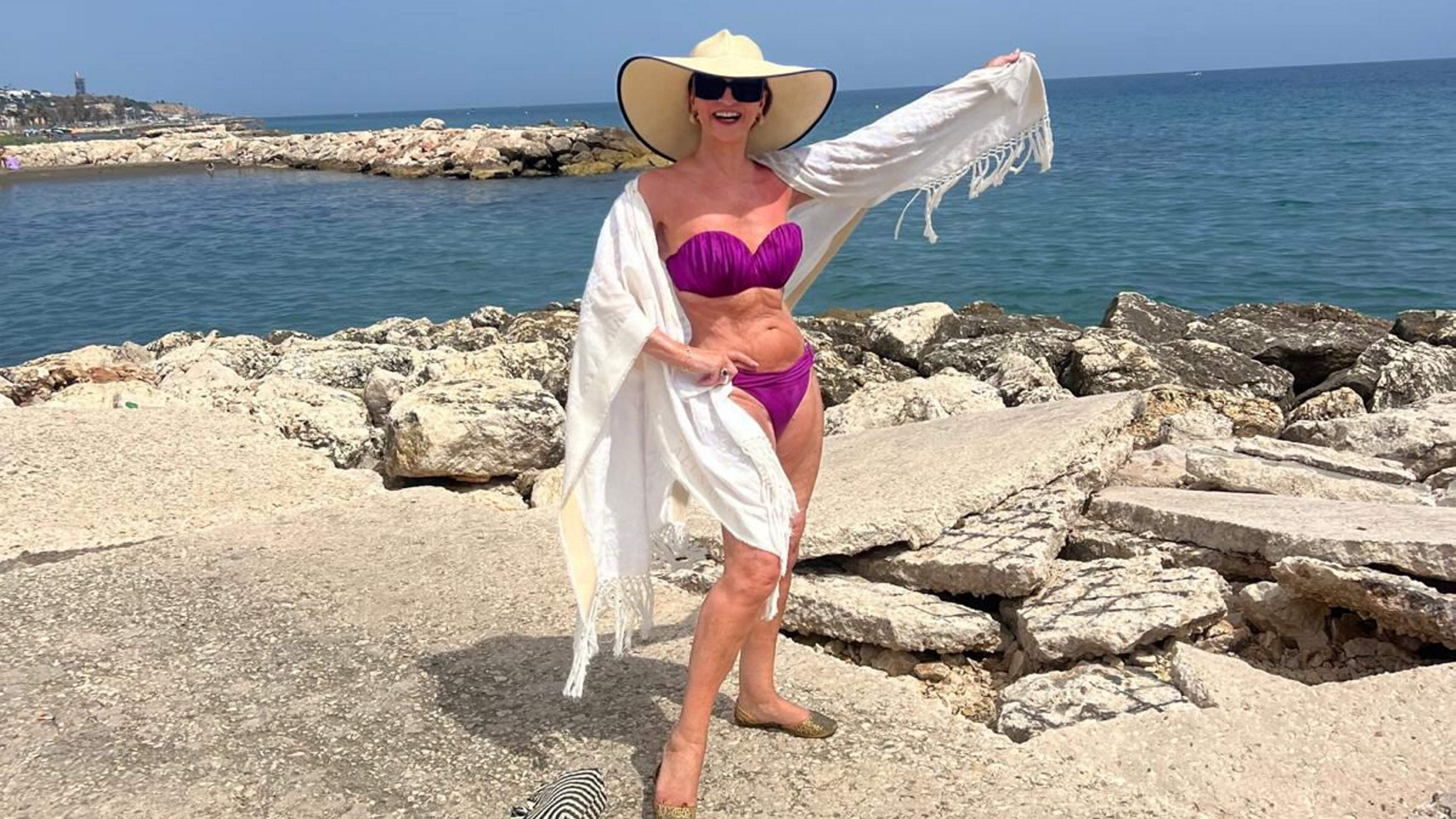 ‘Don’t let the old lady in’: Celia Holman Lee soaks up the heatwave in a bikini at 75