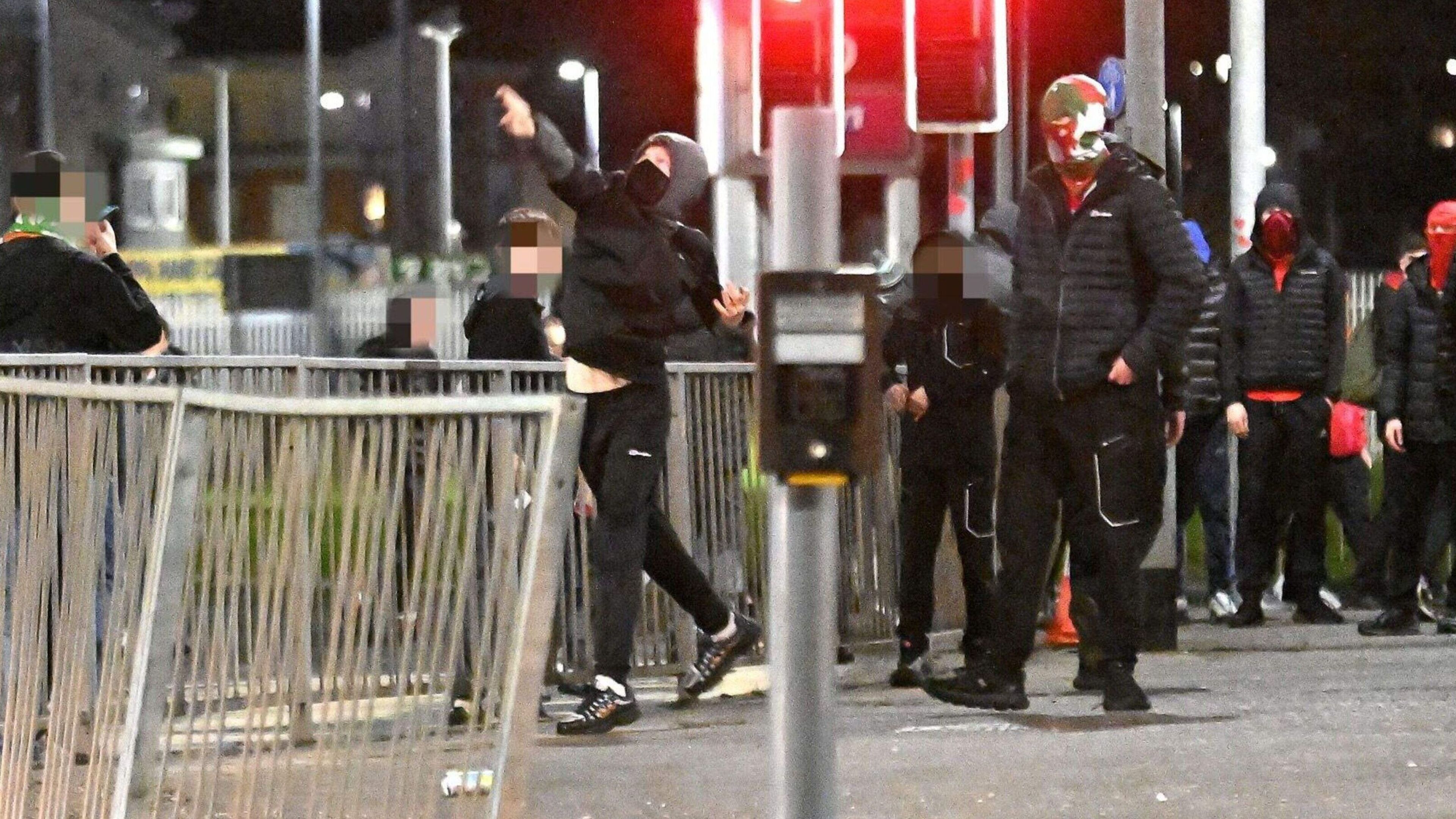 Teen arrested and child struck by bottle with nine PSNI officers injured in Irish Cup football rioting