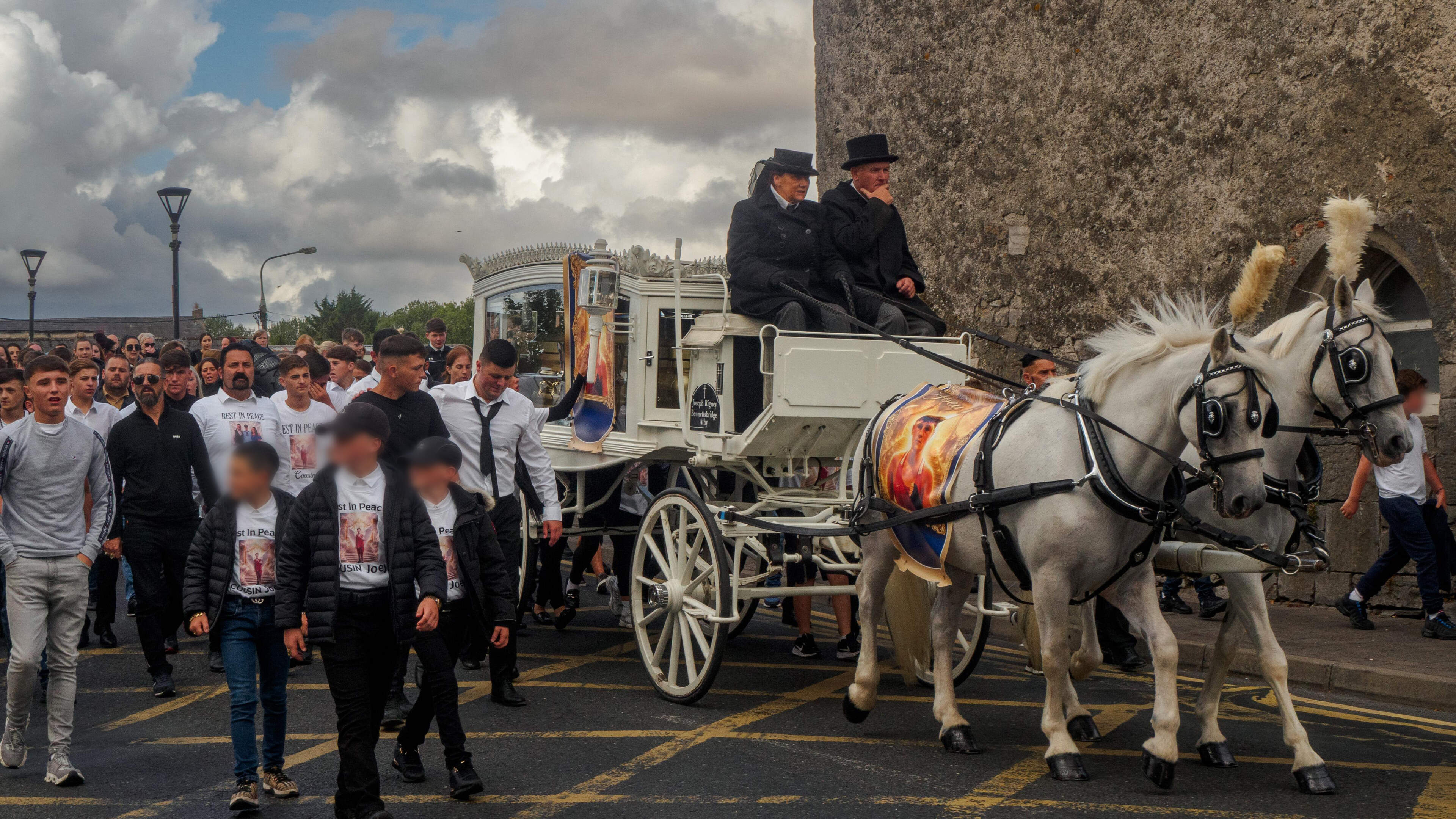 Public order units police first of five funerals of teenagers killed in M9 crash