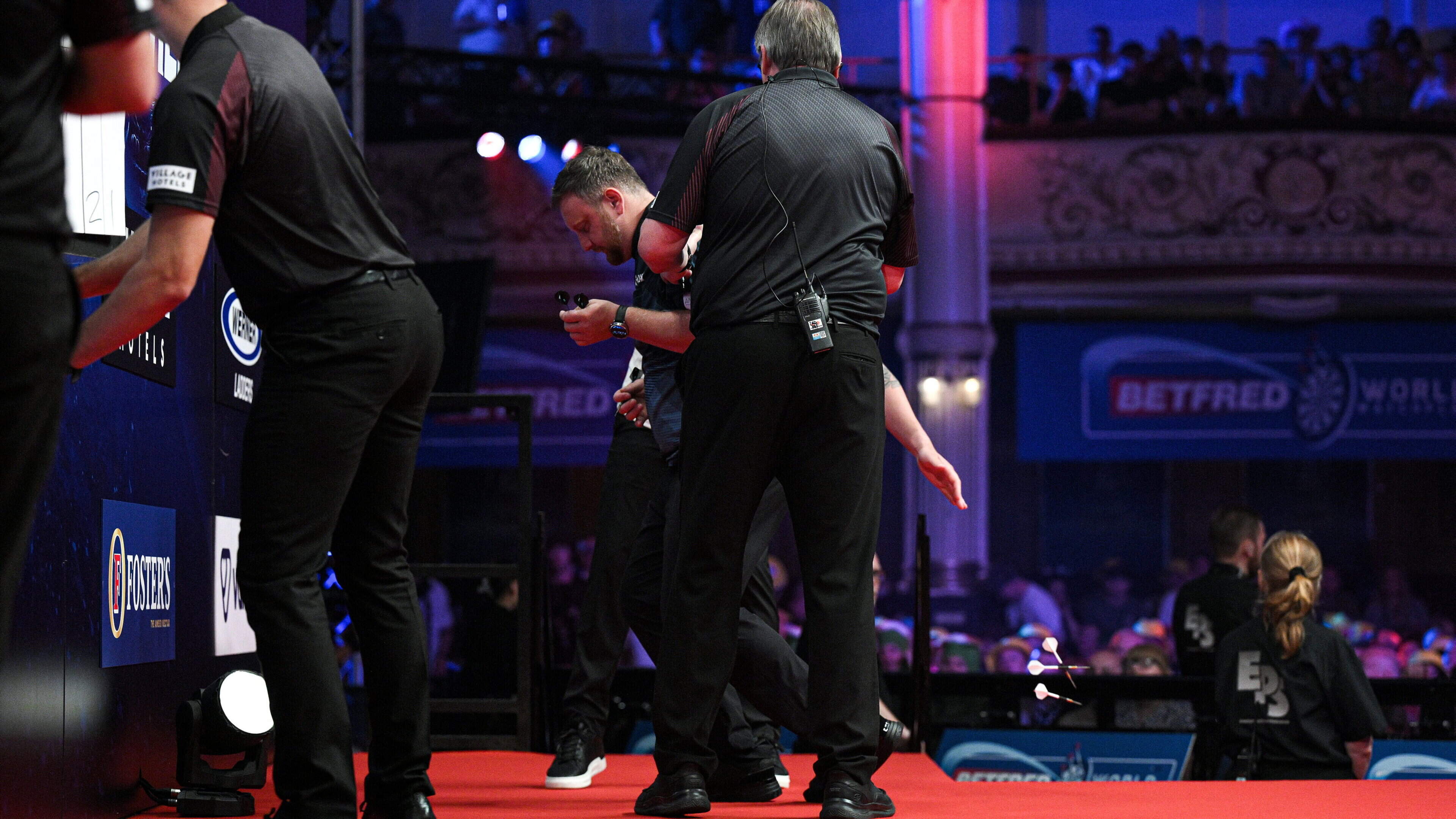 Cameron Menzies given medical attention after taking ill on World Matchplay stage