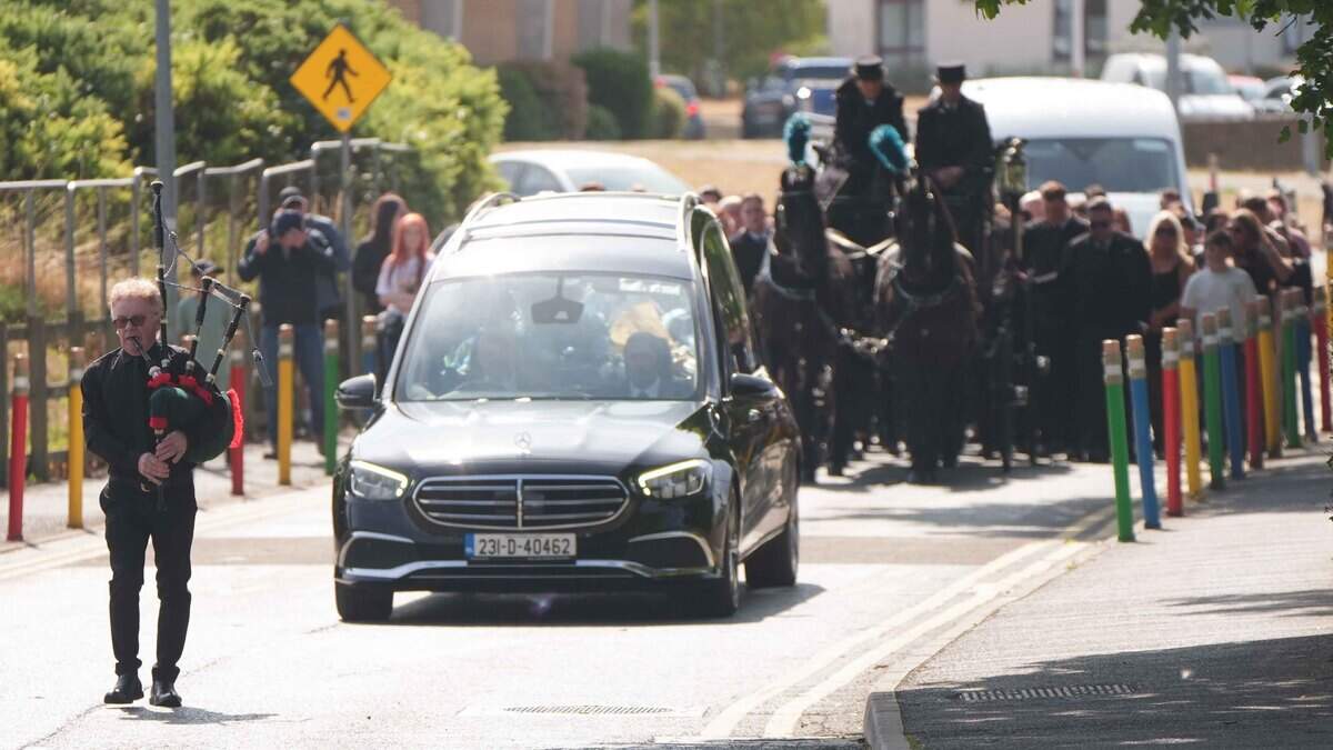 Lone piper leads the slow march of mourners as latest M9 crash teen is laid to rest