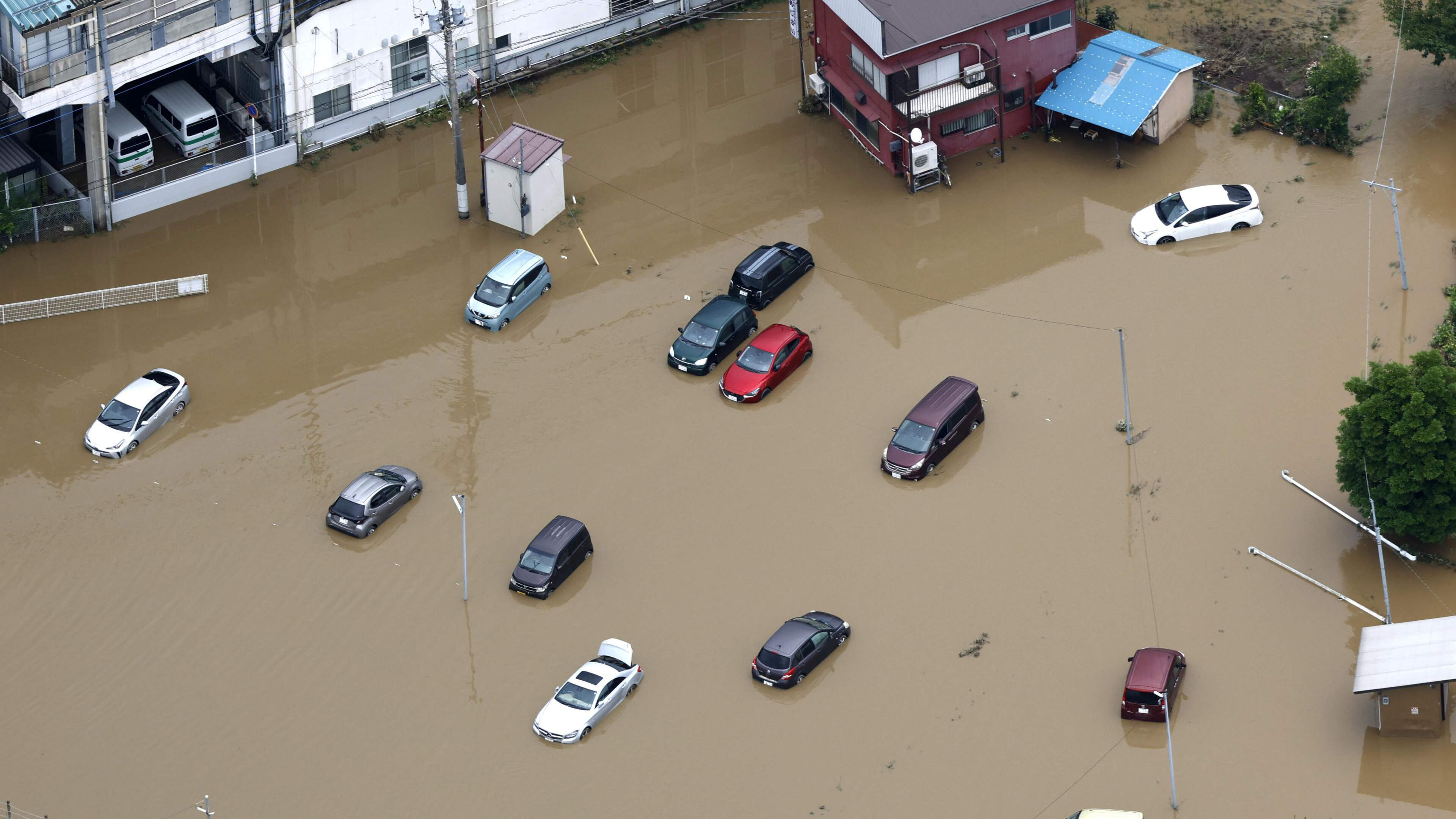 Thousands stranded at Japan's Narita airport after record rain kills four