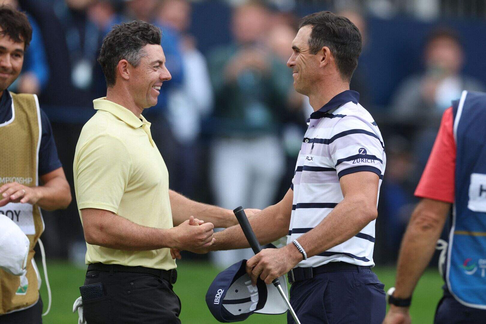 Northern Ireland's Rory McIlroy shake hands with Billy Horschel after the American won the BMW PGA Championship. Action Images via Reuters/Paul Childs