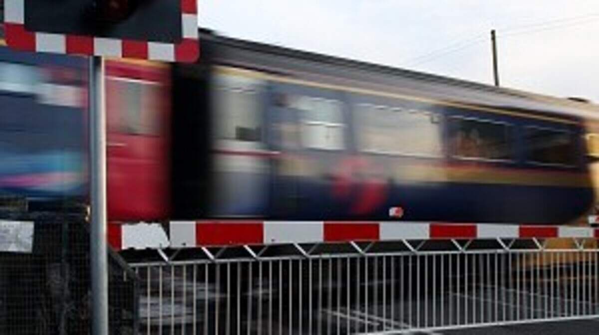 Tractor driver hospitalised after train crashes into vehicle at level ...