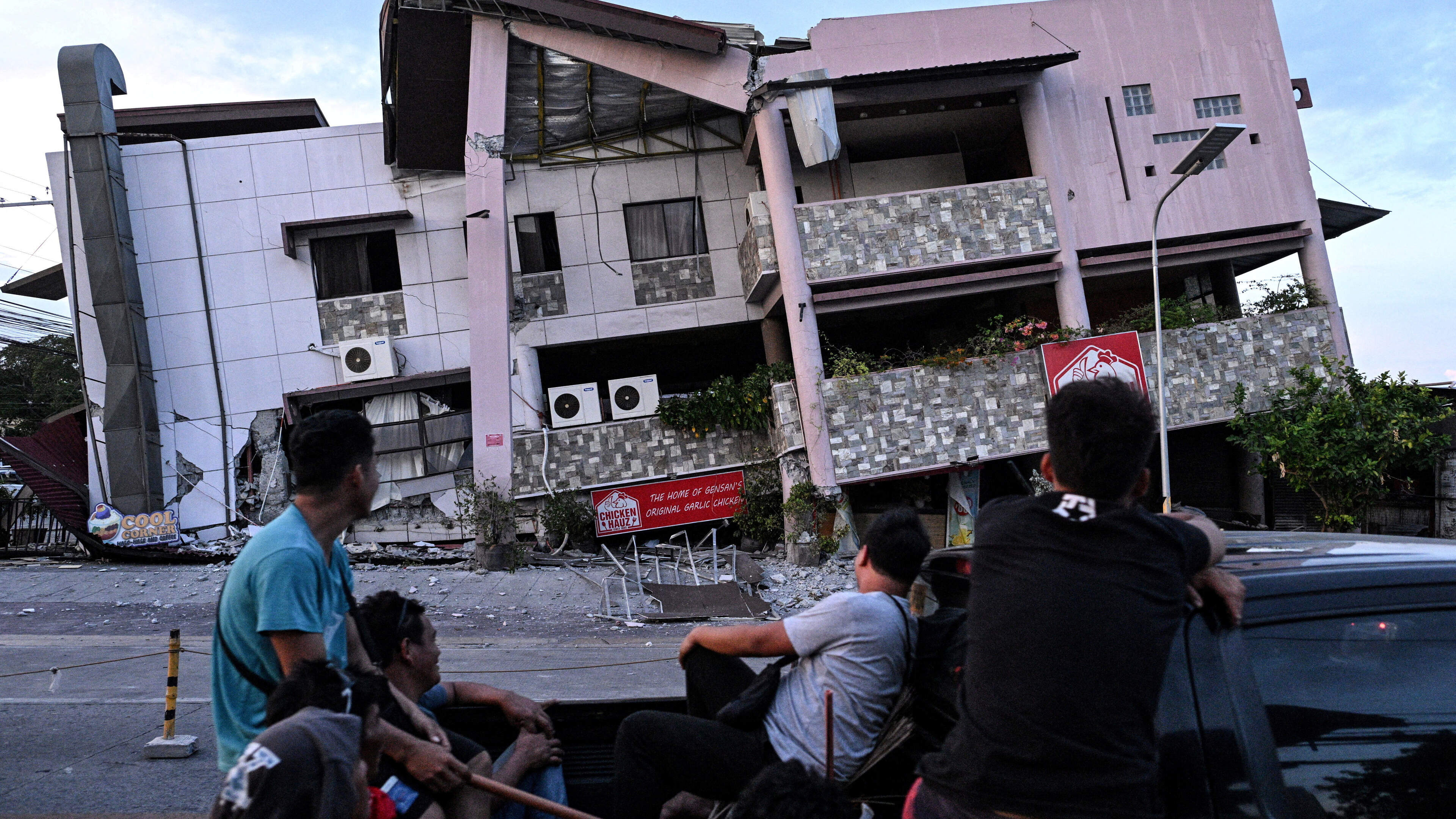 Rescuers race to reach people trapped after powerful quake in southern Philippines