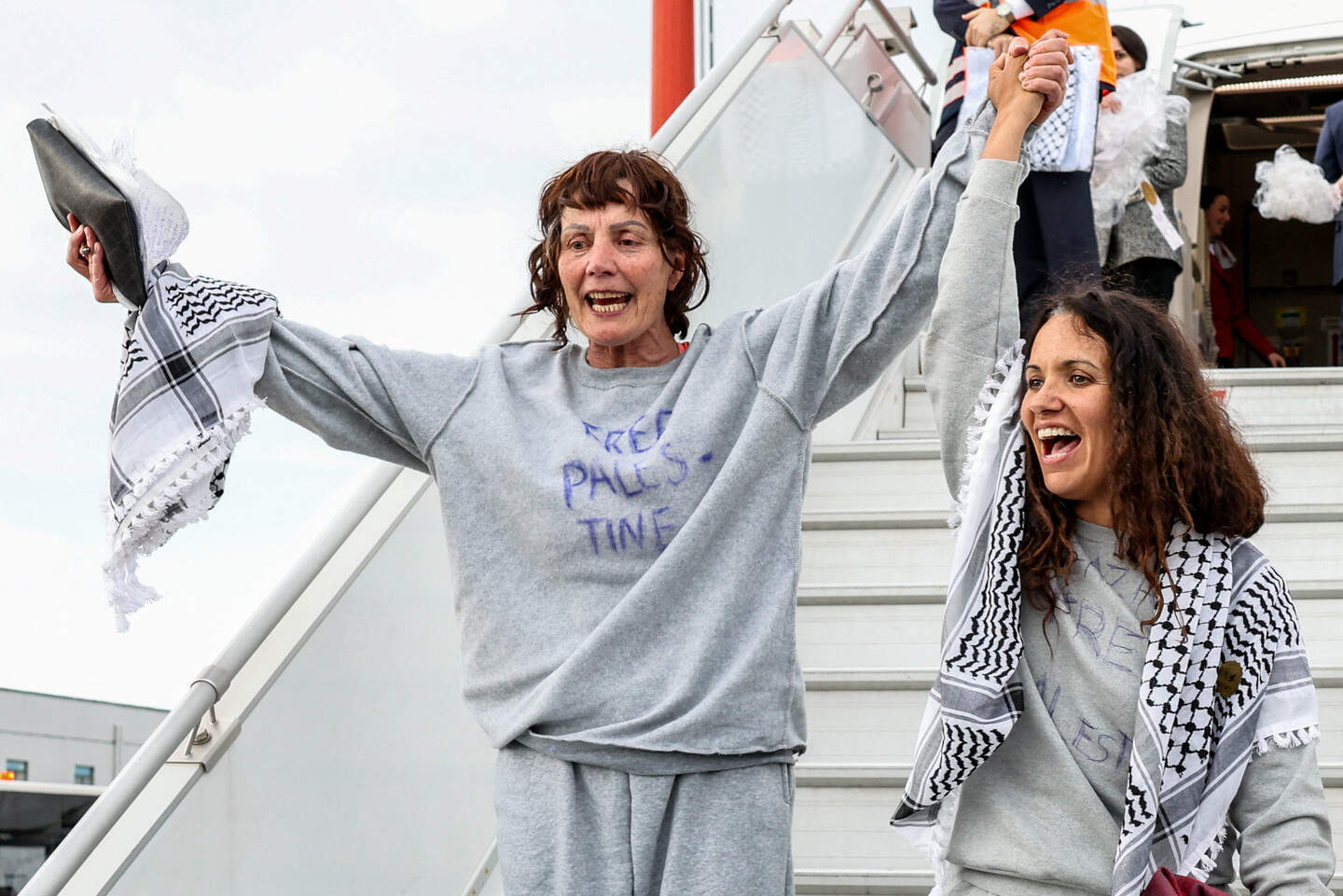 Dr Margaret Connolly, sister of the President Catherine Connolly and another activist from the Gaza-bound Global Sumud Flotilla disembarks a plane upon arrival at Istanbul Airport, Turkey
