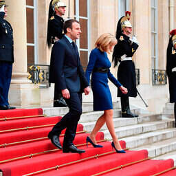 brigitte macron blue dress French first lady Brigitte Macron opts for colourful elegance in fitted  royal blue dress