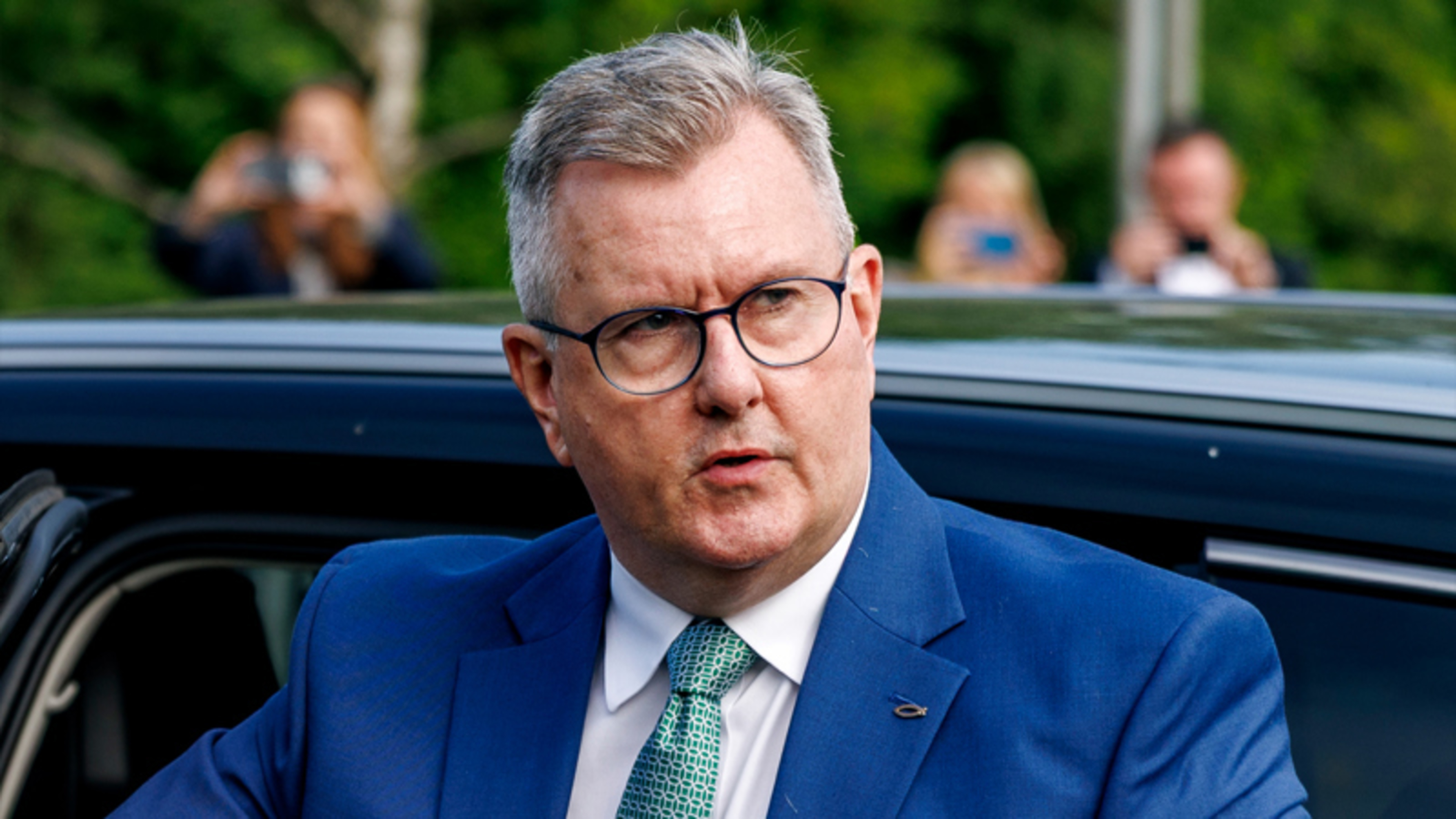 Jeffrey Donaldson arrives for trial as police issue warning over online comments
