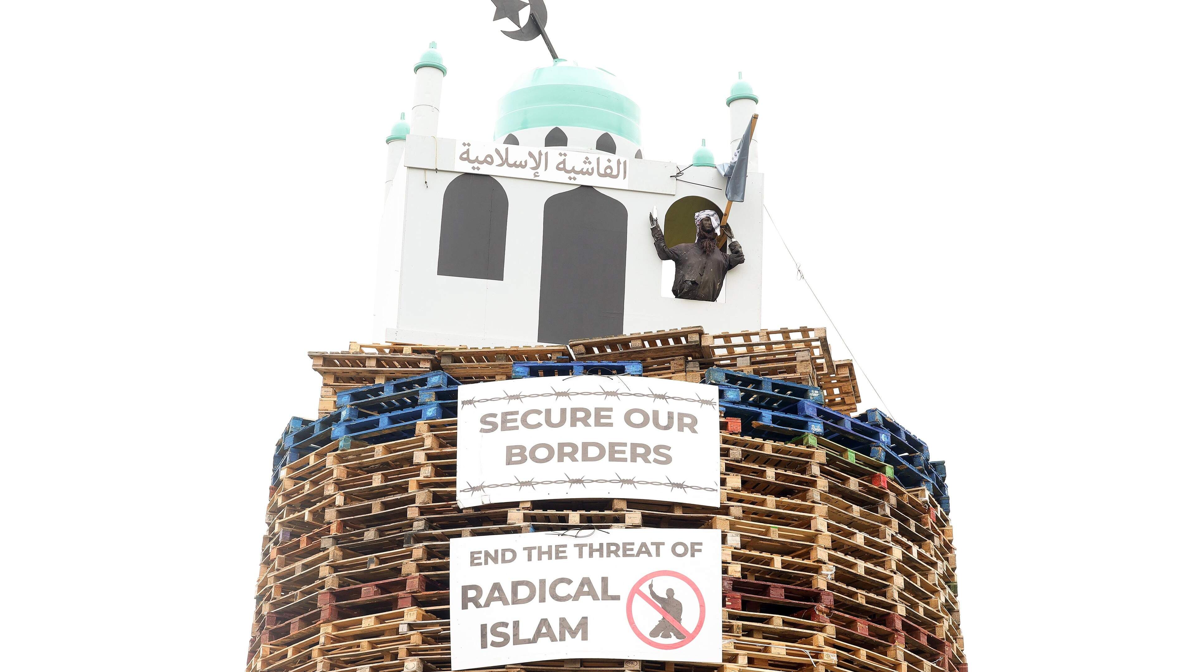 Archbishop warns sectarianism ‘morphing’ into racism after replica mosque placed on top of bonfire in Co Tyrone 
