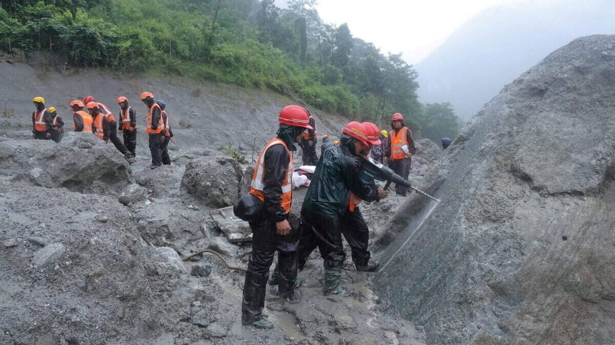 Race to save hundreds of workers trapped in tunnels after Nepal flood disaster