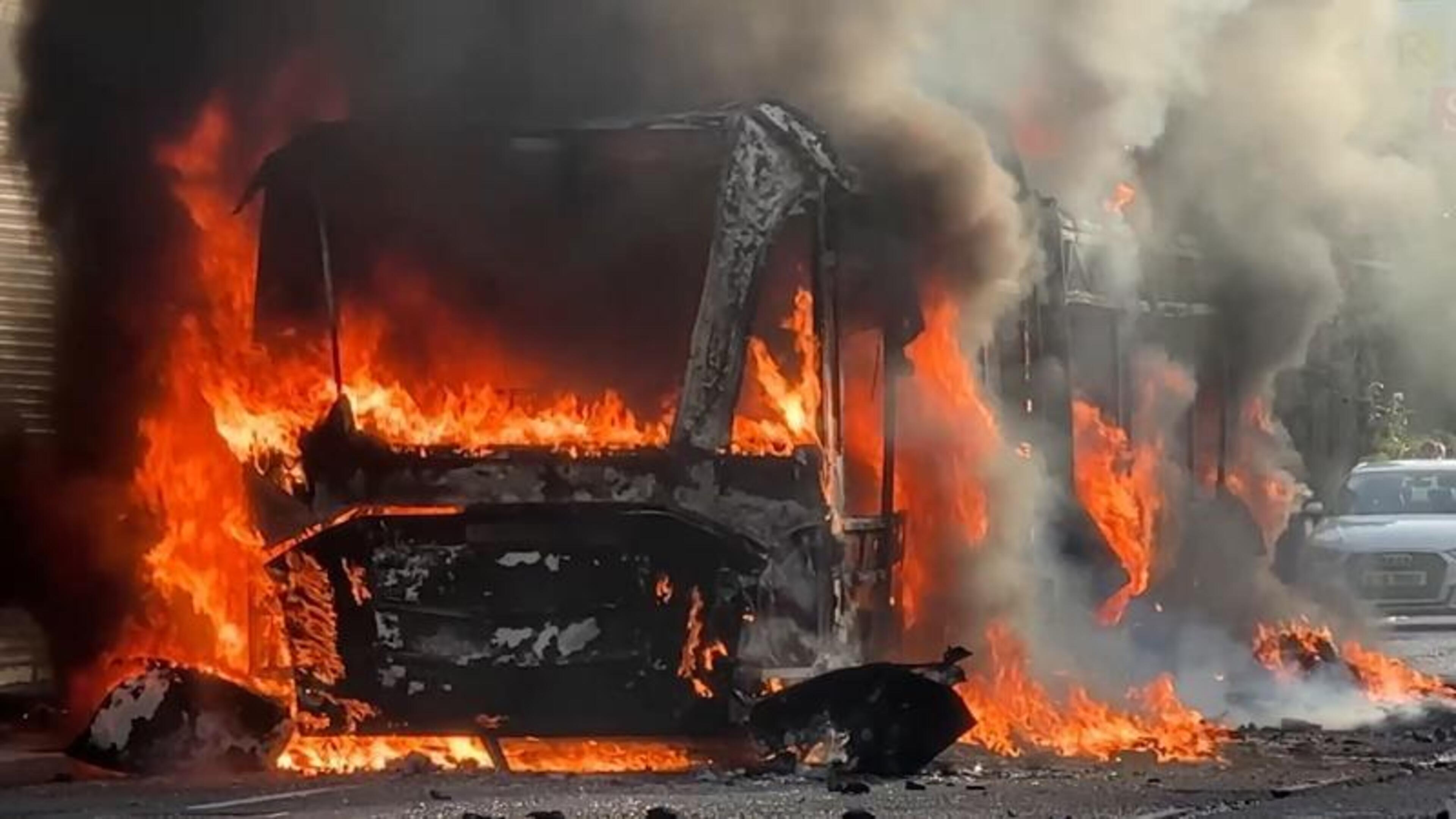 Belfast riots: Homes set on fire and police car and hijacked