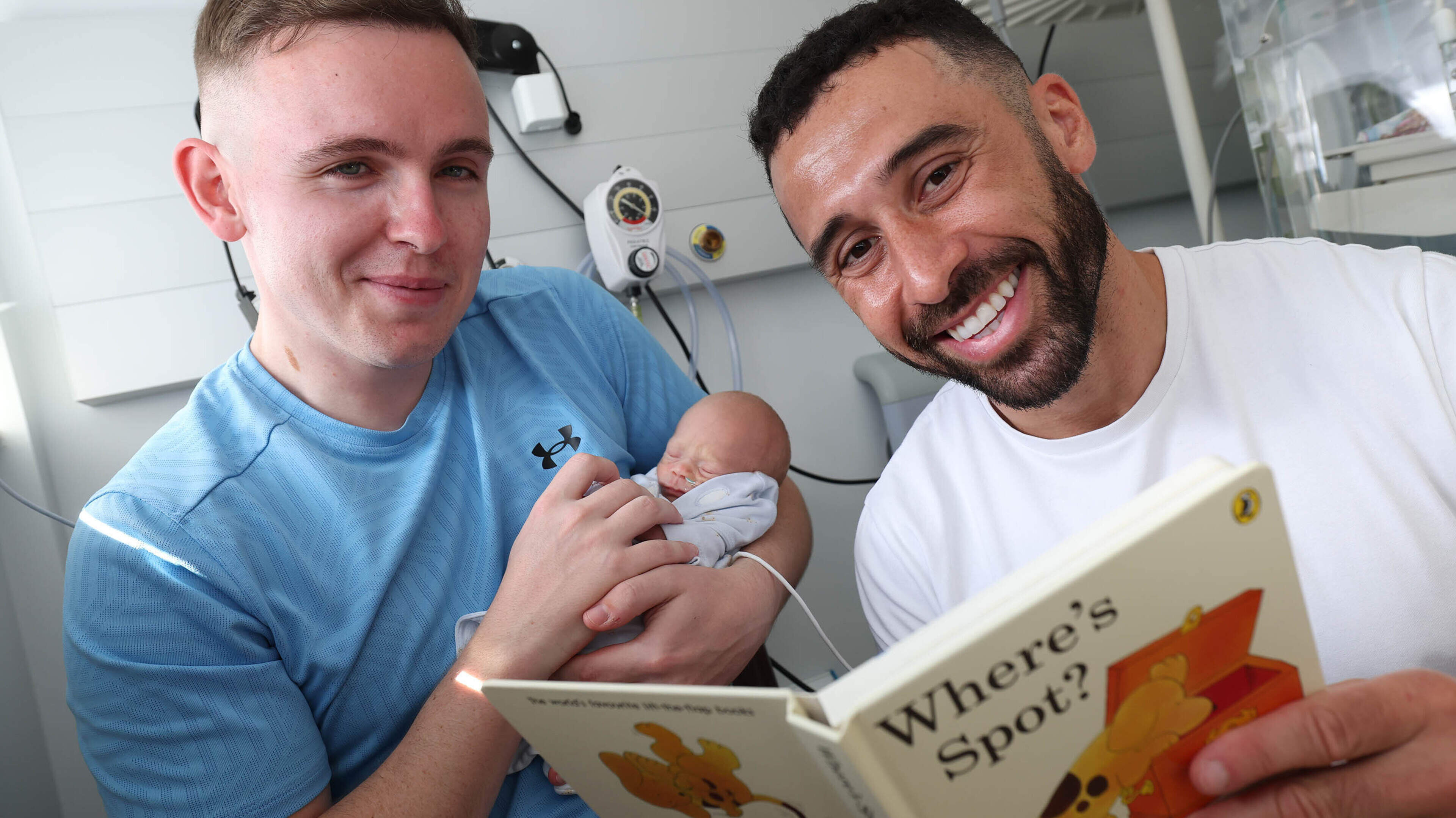 Footballer Pico Lopes reads to premature babies in the NICU at The Coombe Hospital