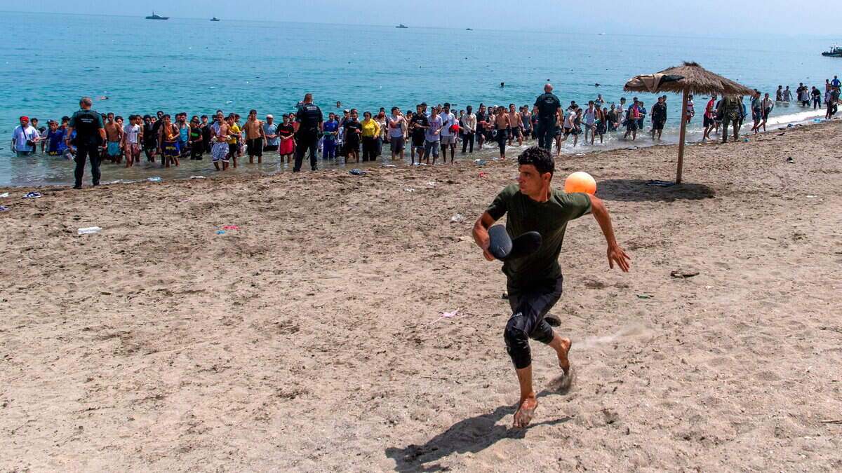 Migrant exodus from Morocco to Spanish territory sparks border crisis as Italy and France urge tighter controls
