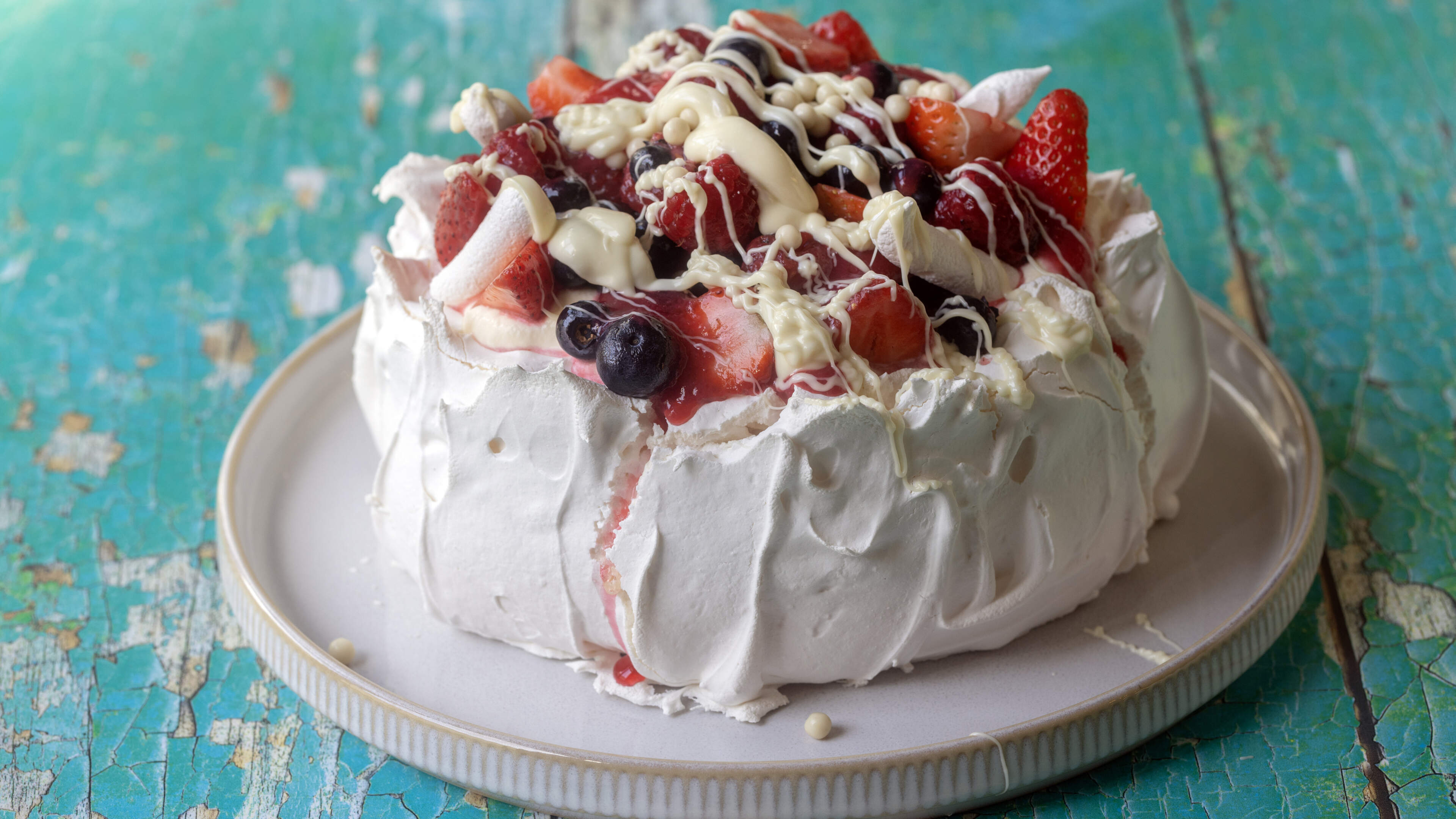 Summer berries and white chocolate pavlova