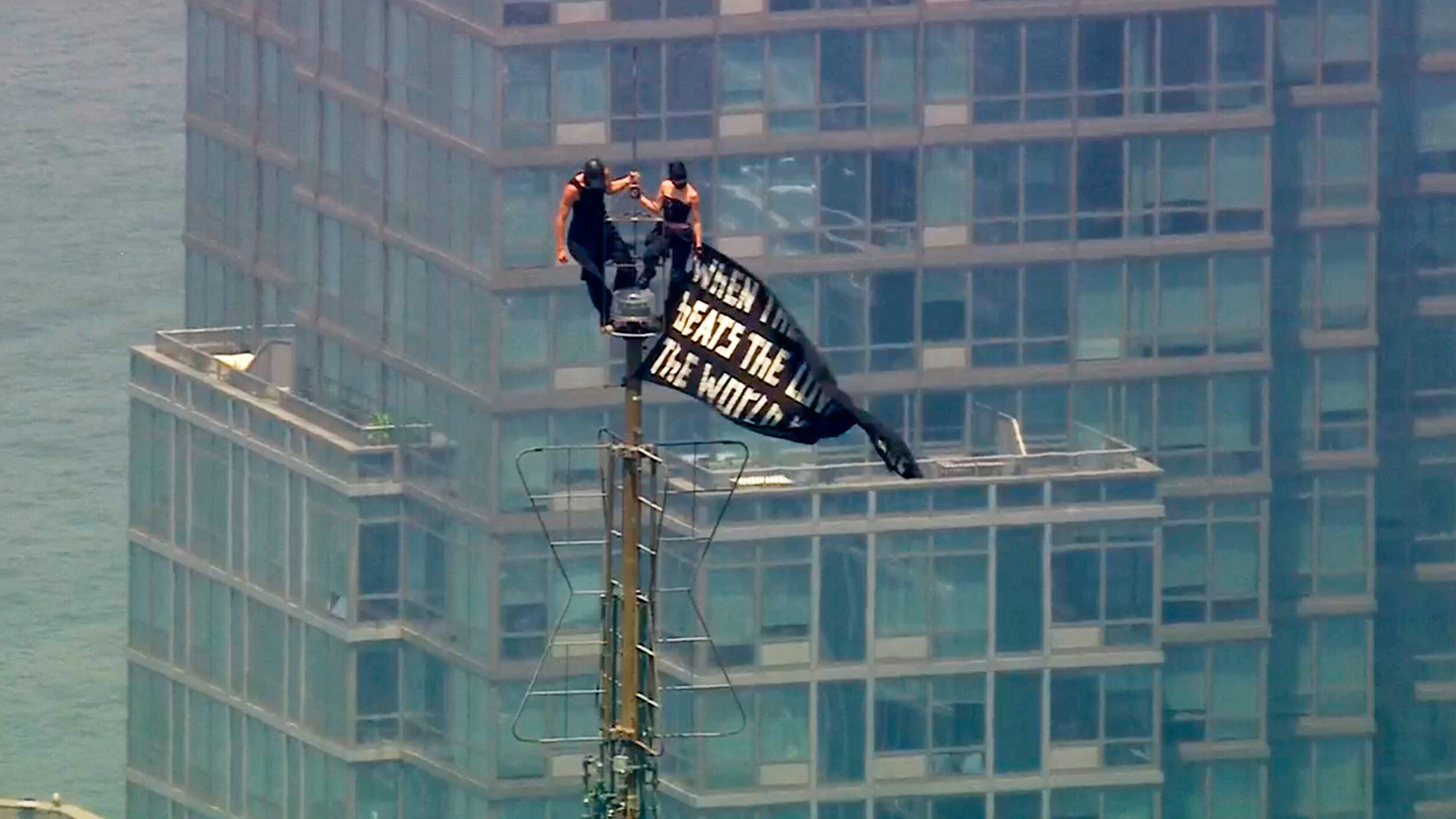 Daredevil couple climb to top of Empire State Building spire for marriage proposal