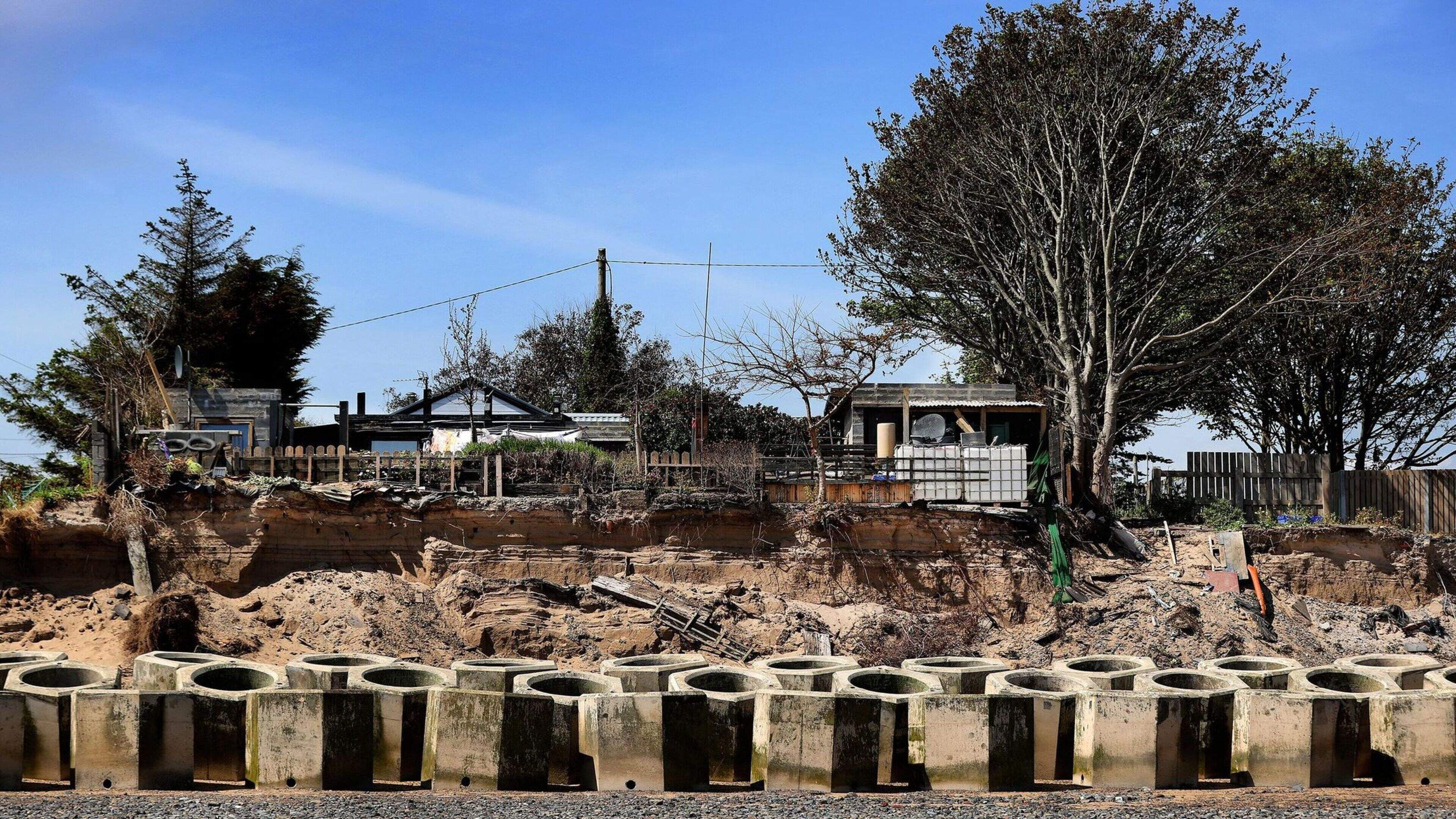 Thousands of homeowners face relocation as coastal erosion t