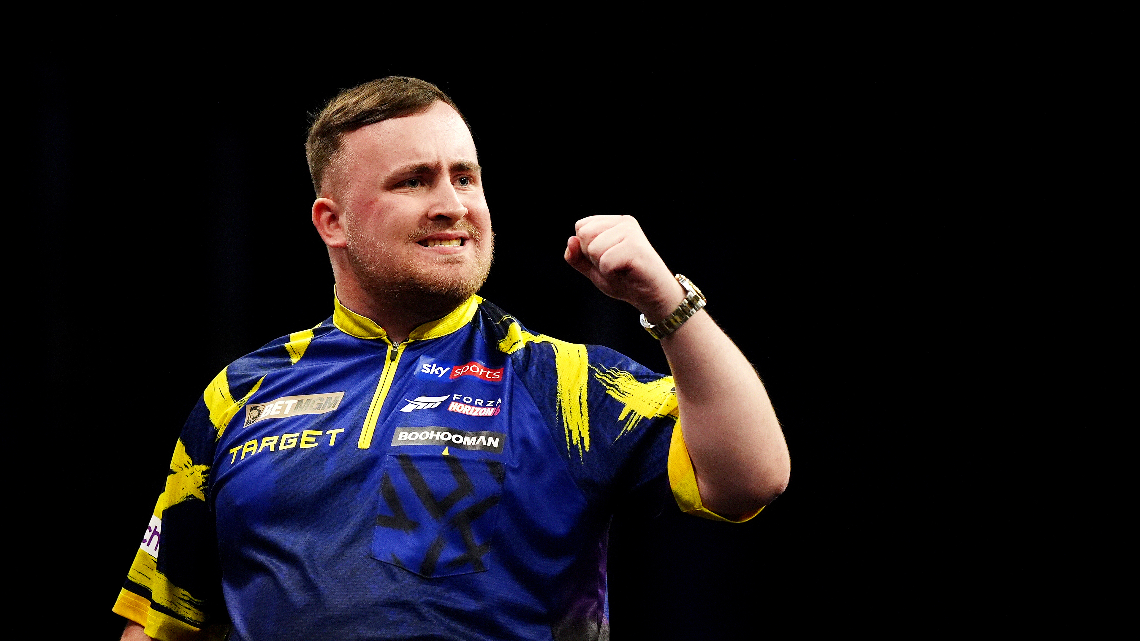 Luke Littler hits nine-darter in win over Nathan Aspinall to continue World Matchplay defence
